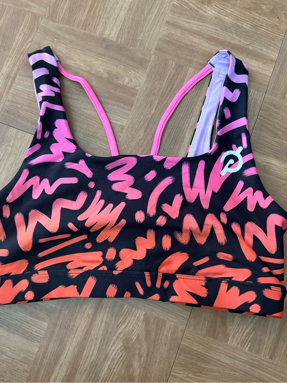 Peloton Black Sports Bra with Pink and Orange Brushstroke Print